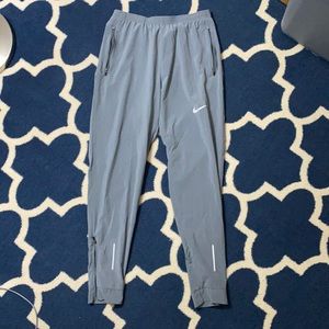 Nike windbreaker pants with reflective accents